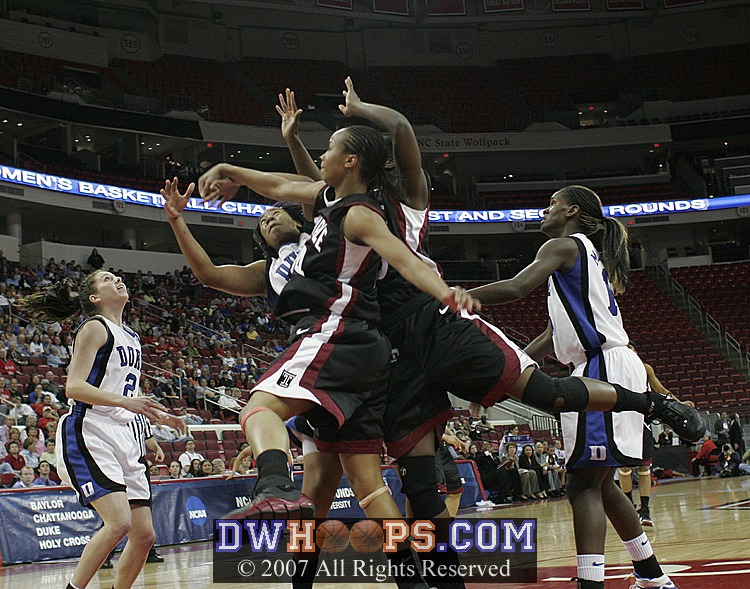 After the miss, the post players collide...