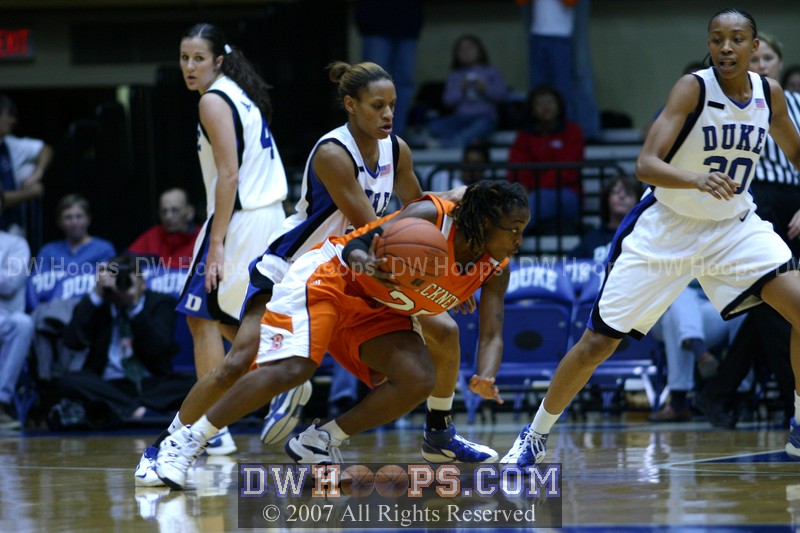 Keisha Champion tries to keep the handle against Jasmine Thomas