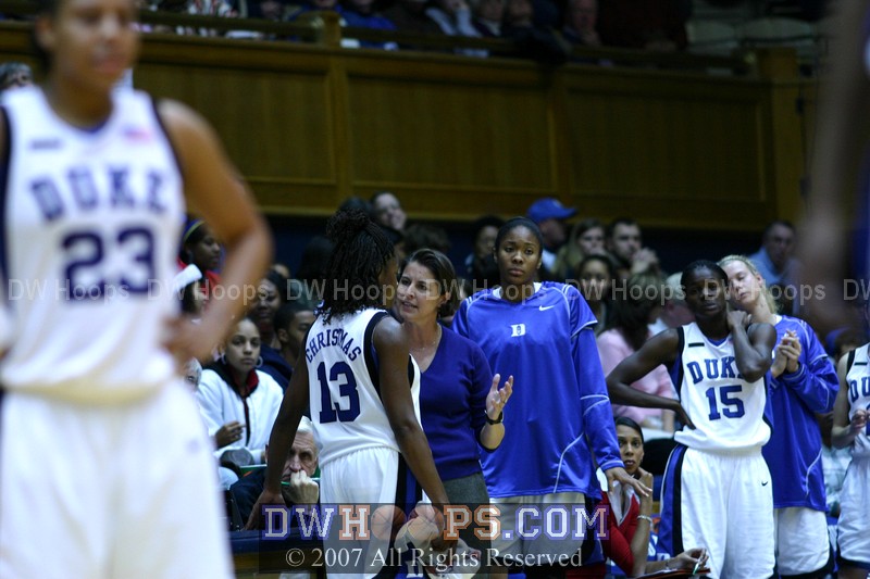 Coach McCallie calls Karima Christmas over to the bench for a little talk