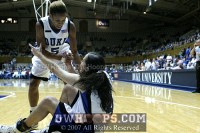  - Jasmine Thomas helps up Abby Waner after Novacek blocked her shot