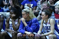  - Karima Christmas, Brittany Mitch, and Emily Waner watch from the bench