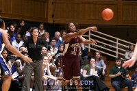  - Latoya Bennett whips a pass while Coach P directs her Blue Devil defense