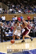 Wanisha Smith fends off Mara Freshour while driving to the hoop -  - 