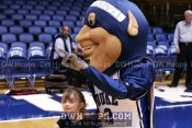 The Duke Blue Devil poses with a young fan -  - 