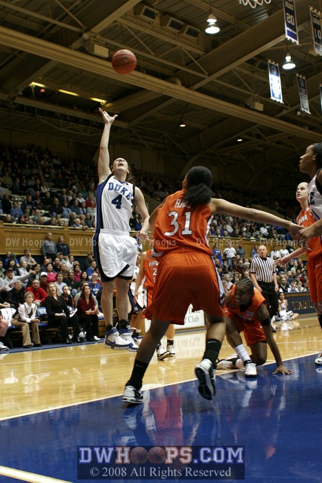Abby misses the jumper after her defender has fallen down