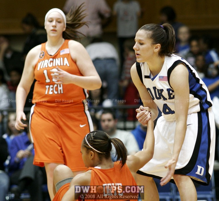 Abby helps up Utahya Drye after fouling her