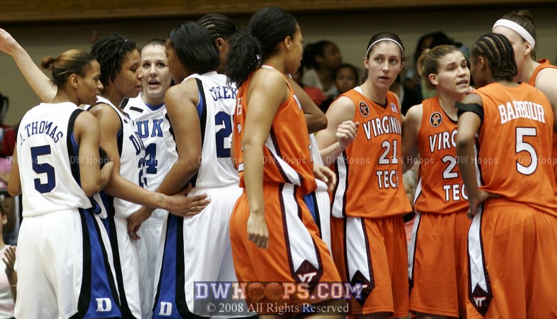 Two very different huddles after Wanisha Smith scored and was fouled