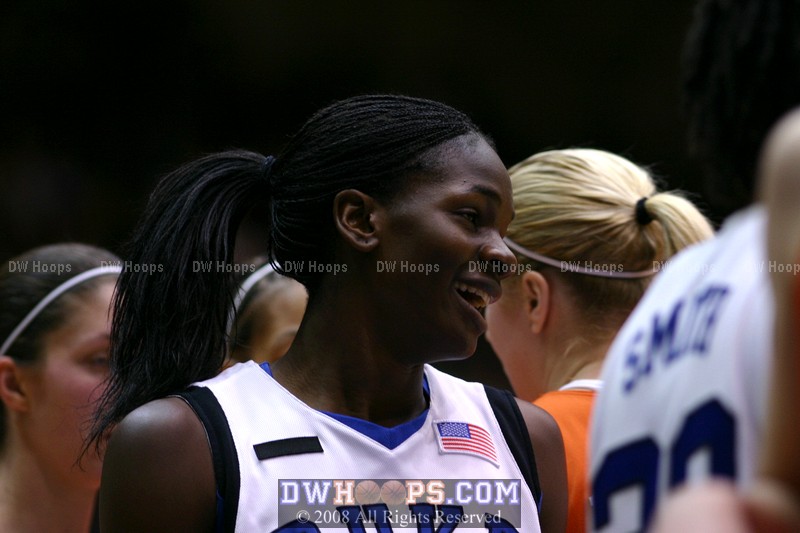 Bridgette Mitchell after a massive block by Chante Black