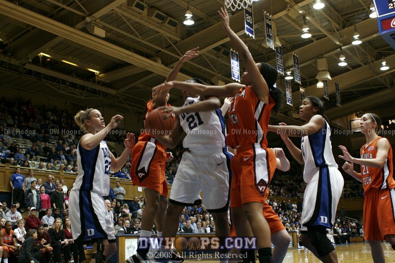 Joy Cheek battles for a defensive board