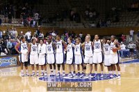 The 11 Blue Devils gather at mid-court for Dear Old Duke. - Postgame - 