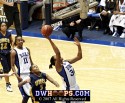  - Krystal Thomas pins the ball on the bottom of the backboard