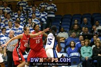  - Bridgette Mitchell tries to drive against Heather Zurich (21) and Kia Vaughn (15).  Her layup would miss.