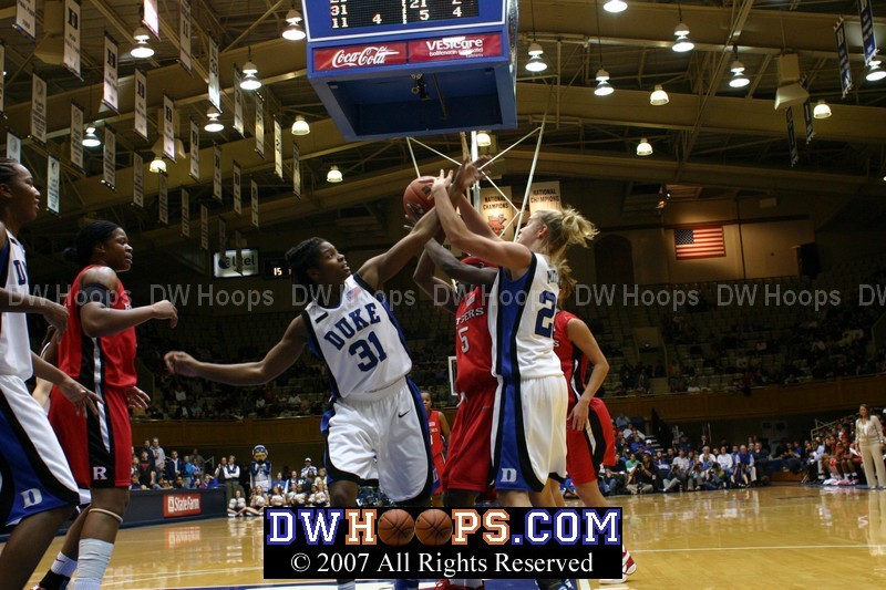 Battle for a rebound underneath after a Rutgers miss