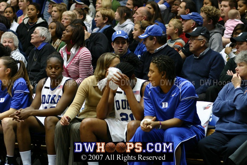 Joy Cheek on the bench, icing a large egg on her forehead