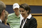  - Coach McCallie signs an autograph for a fan after the press conference