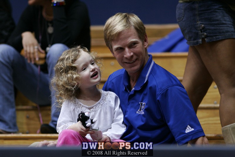 In the stands, Duke Associate Women's Soccer Coach Billy Lesesne and his daughter