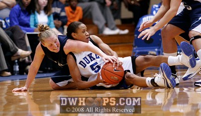 Jasmine Thomas (5) and Kristin Baker struggle for a loose ball