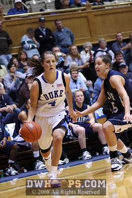 Abby Waner confidently dribbles past Tanna Ross