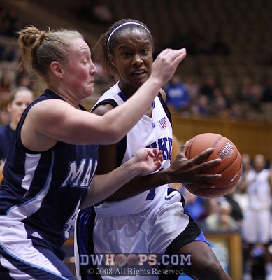 Chelsea Hopkins drives and draws yet another foul, this time from Baker