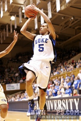 Jasmine Thomas shoots after the first half clock has expired -  - D5;1, 0:00, 30-13