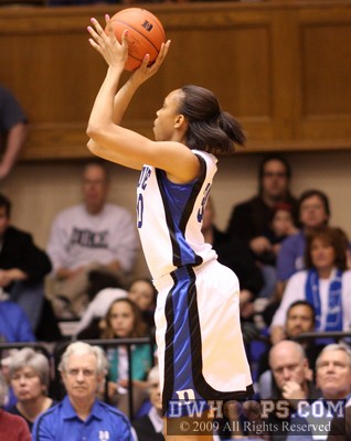 Carrem Gay, wearing pink nail polish in honor of Kay Yow and others, tries a jumper early in the second half -  - D30;2, 15:45, 34-17