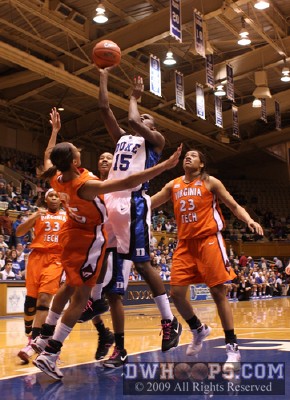 Durham native Utahye Drye is not quick enough to draw the charge from Bridgette Mitchell -  - 