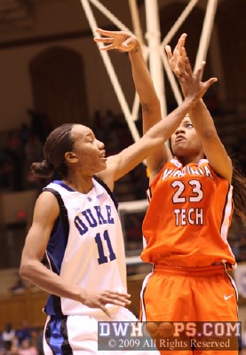 Brittany Gordon shoots over Chante Black -  - 