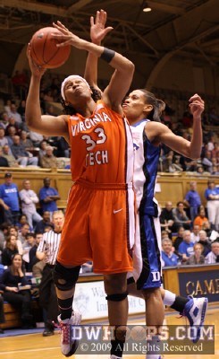 Jasmine Thomas tries to erase a Shanel Harrison shot from behind -  - 