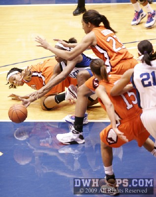 Players scramble for a loose ball -  - 