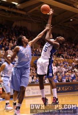 After the fake, Mitchell shoots and draws more contact from Breland - this time it's a foul -  - D15.O51;1,10:06,18-15