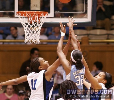 It's hoop and harm for Rashanda McCants as she draws Chante Black's second foul.  Black would not return until the start of the second half. -  - D11.O32;1,4:52,27-23