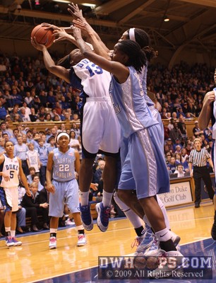 Karima Christmas can't finish the layup under the weight of UNC's bigs -  - D13;1,2:03,33-27