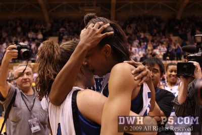 Abby Waner, Carrem Gay, and Chante Black embrace at center court after the most dramatic Senior Night victory in Duke history (first of two photos) -  - 