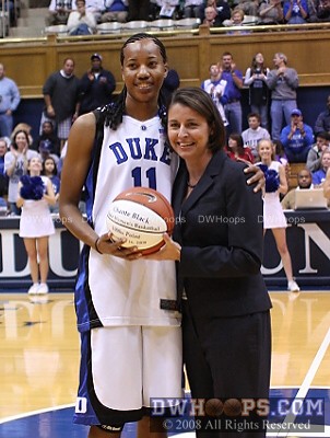 Chante Black receives a commemorative ball for scoring her 1,000th point against Maine -  - D11.JPM;