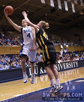 Abby protects the ball, scoring and drawing the foul from the much taller Hamlin