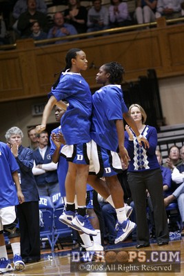 Karima Christmas provides a chest bump for Carrem Gay during pregame intros