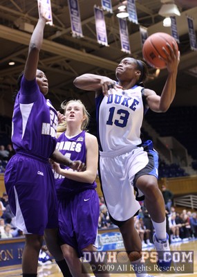 Karima Christmas eyes the basket as Kanita Shepherd gets a hand in the way -  - 