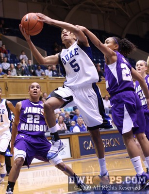 Jasmine Thomas goes to the hoop as Dawn Evans tries to stop her -  - 