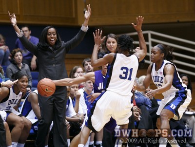Duke assistant coach Samantha Williams encourages Keturah Jackson and Karima Christmas during a sideline trap -  - 