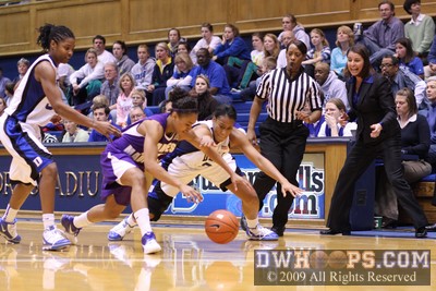 JMU's Dawn Evans and Joy Cheek reach for a loose ball -  - 