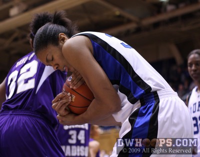 Krystal Thomas protects an offensive rebound during the closing moments of the game -  - 
