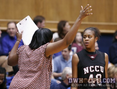 NCCU assistant Leah Frierson encourages J'Mia Pollock to get her arms up -  - 