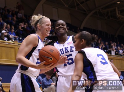 Bridgette Mitchell and Shay Selby share a moment with Kathleen Scheer, who just laid out for a loose ball.  Duke was up by 70 or 80 at that moment. -  - 