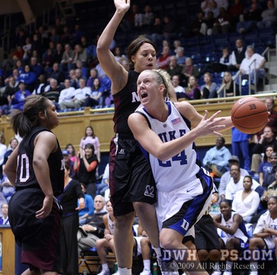 Kathleen Scheer drives but is whistled for a player control foul. -  - 