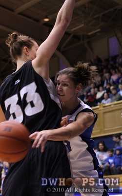 Allison Vernerey squeezes a pass around Providence's Emily Cournoyer -  - 