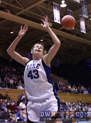 Allison Vernerey trying for an offensive rebound that took a weird bounce off the rim -  - 