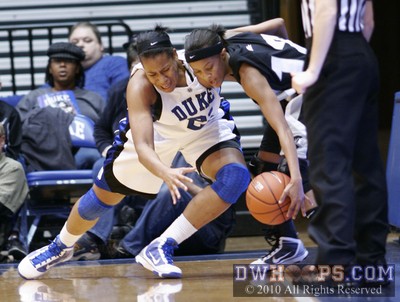 Joy Cheek and Symone Roberts compete for a loose ball -  - 