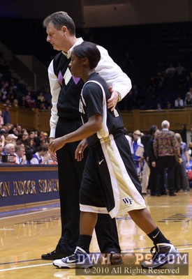 Wake Head Coach Mike Petersen leads Brooke Thomas to the huddle after a little talk -  - 