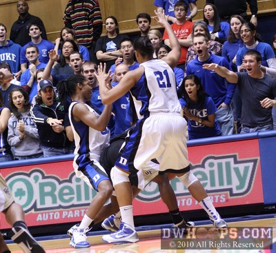 Pressing Duke defenders swarm a Wake player as the crowd also gets into it -  - 
