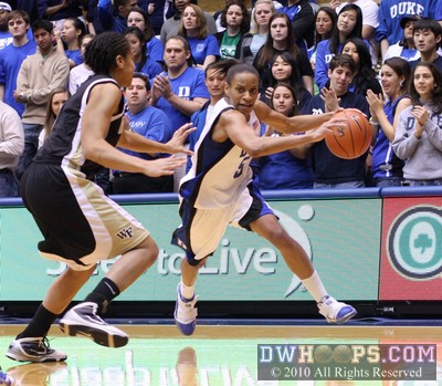 Jasmine Thomas drives past the three point arc -  - 